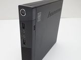 a close up of a desktop computer sitting on top of a white table