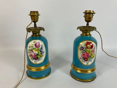 pair of blue and gold vases with flowers on them