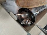 a box with a bunch of silver spoons and spoons inside of it