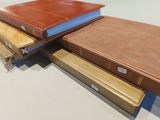 three books stacked on top of each other on a table