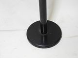 an image of a black floor lamp on a white floor