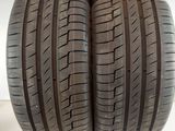 two tires are stacked on top of each other on a white surface