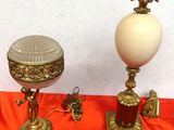 two lamps that are sitting on a red cloth