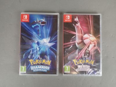 two nintendo wii games are sitting on a table next to each other