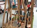 a display of gardening tools on display in a garage