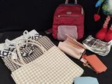 a bag, purse, wallet, cell phone and other items on a table