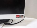 a computer monitor sitting on top of a white desk