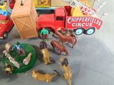 a lot of toy animals that are on the table
