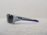 sunglasses on a table with a white wall in the background