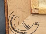 an image of a close up of a piece of wood with a stamp on it