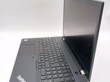 a laptop with a black keyboard sitting on a white surface