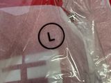 a stuffed animal in a plastic bag on a table