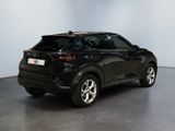 the rear end of a black suv parked in a room