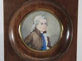portrait of a man in a brown coat and blue shirt