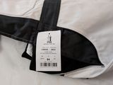 a label on the back of a black and white jacket