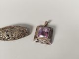 two silver and amethe pendants, one with an amethe stone