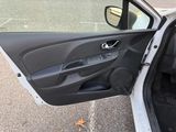 a car door open on the side of the road