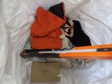 a pair of skis and a pair of skis laying on a bed