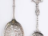 three silver spoons with a ship and a ship on them