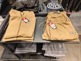 two pairs of pants sitting on a table in a store