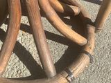 a close up of a wooden table with an umbrella on top of it