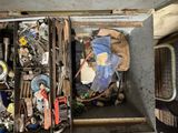 a metal box filled with assorted items in it