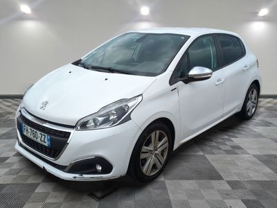 the small white car is parked in the room on a checkered floor