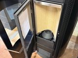 a black stove sitting inside of a kitchen next to a stove