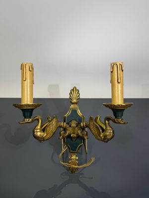 pair of antique brass wall sconces in the form of two swans