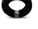 a close up of a tire on a white surface with a sticker on it