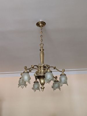 a chandelier hanging from the ceiling in a room