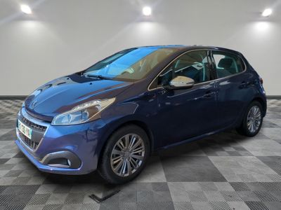 a picture of a blue car parked in a garage