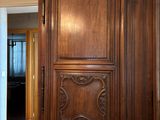 a large wooden door in the middle of a room