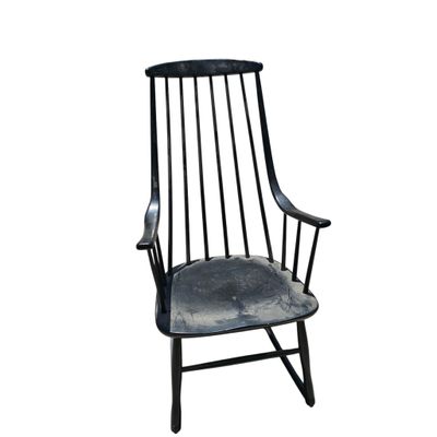 the chair is black and has a black seat and back