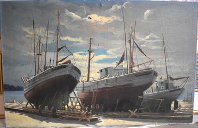 two boats that are sitting in the sand