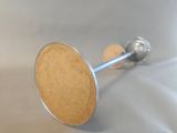 a close up of a knob on a white surface
