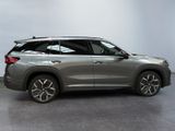 the rear view of a silver 2020 toyota highland