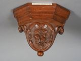 a wooden shelf that has a plaque on it