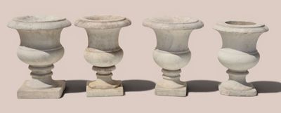 three vases sitting next to each other on a table