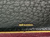 a close up of a black and red purse with a gold clasp