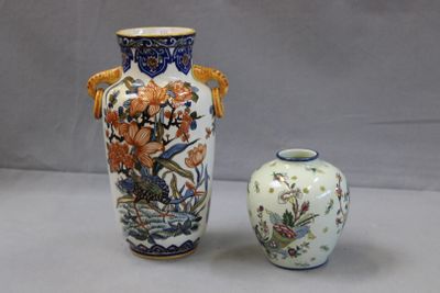 two vases sitting next to each other on a table