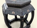a black and blue table with a flower design on it