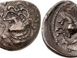 a silver coin with an image of a man and a woman on it