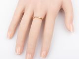 a close up of a person ' s hand with a ring on it