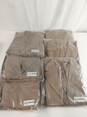 several bags of brown cloth sitting on top of a white table