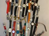 a lot of watches that are sitting on a table