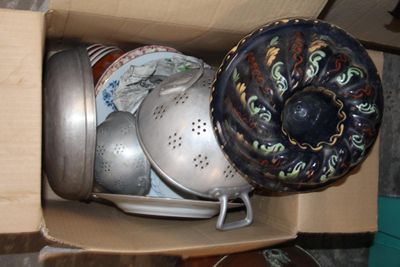 a box full of pots and pans sitting on a table
