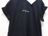 black t - shirt with white writing on the chest and a white tag on the chest
