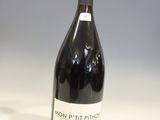 a bottle of wine that is sitting on a table
