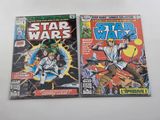 two star wars comic books on a white surface